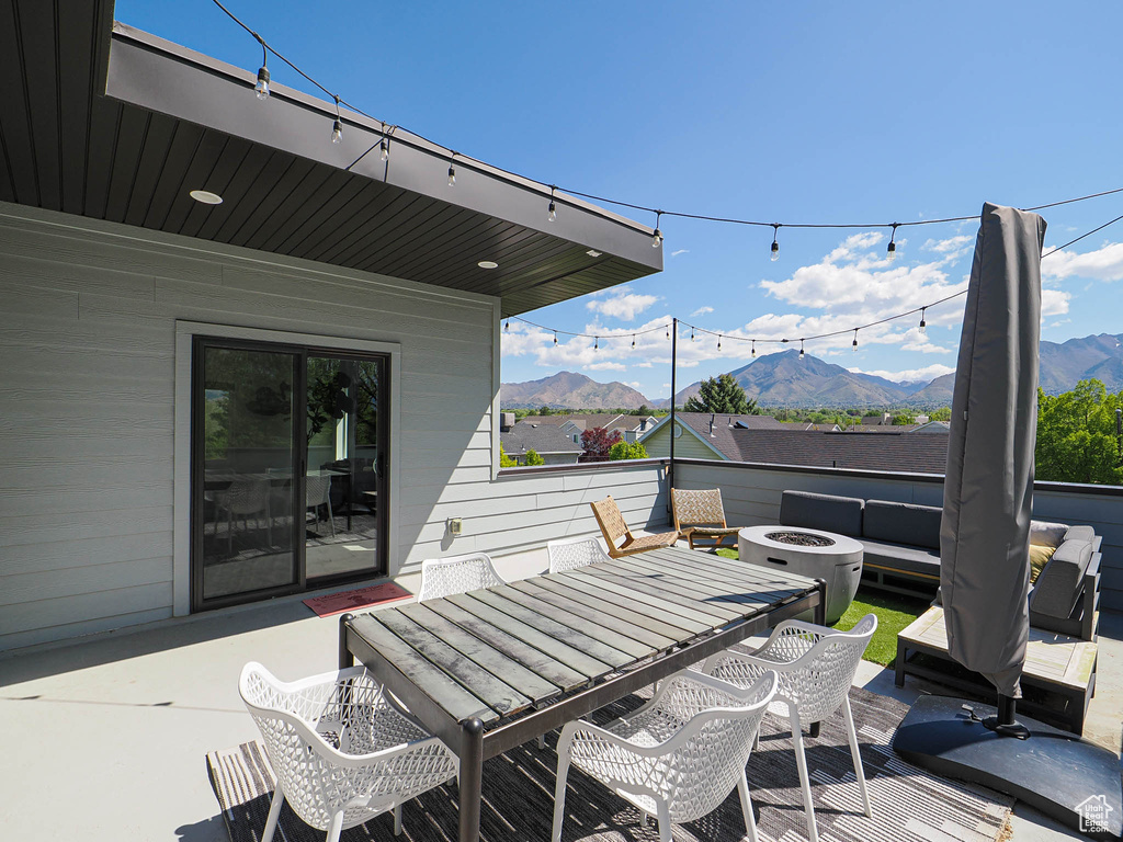 View of patio featuring a mountain view and outdoor dining space