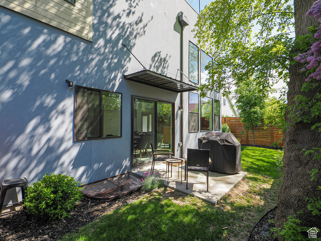 Back of property featuring a patio and stucco siding