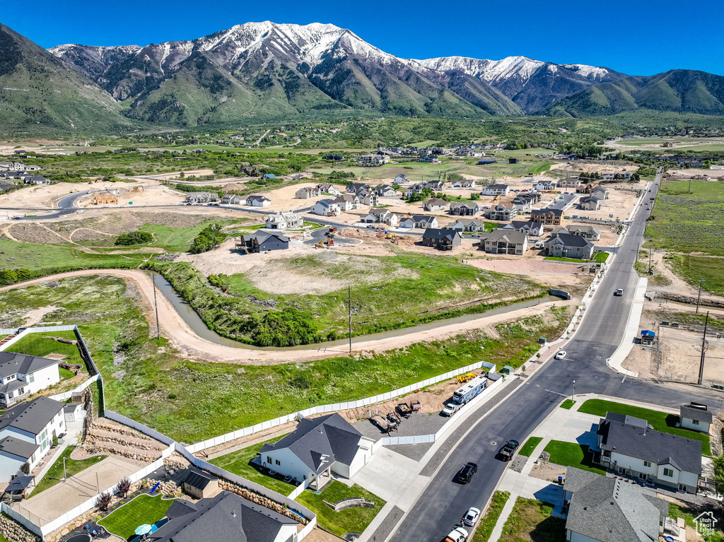 Aerial view of property\\\'s location with nearby suburban area and a mountainous background