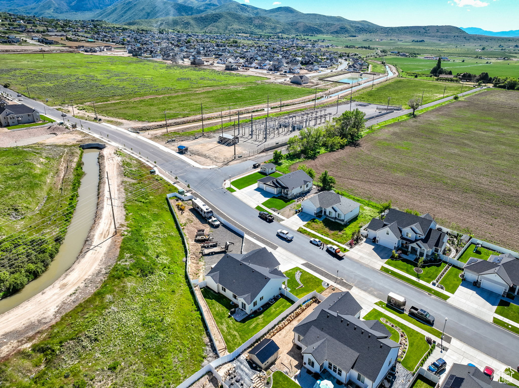 Aerial perspective of suburban area featuring a mountain backdrop