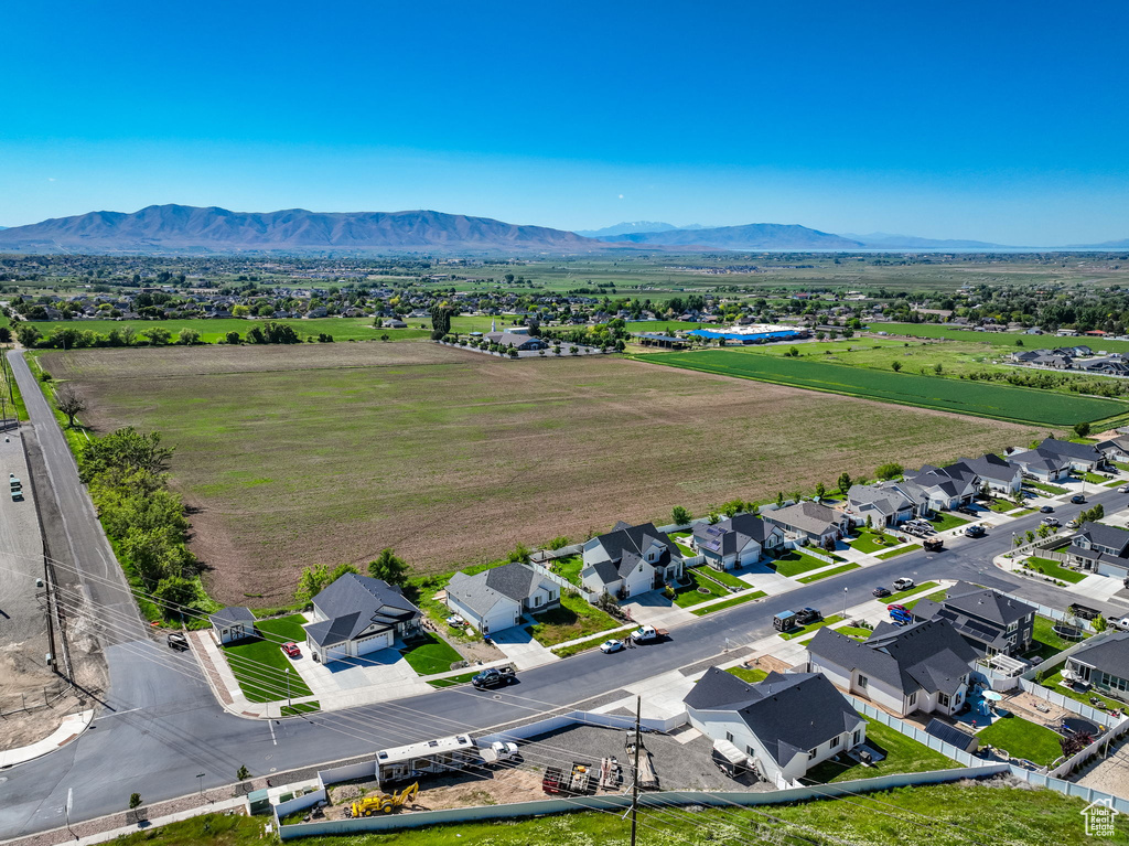 Aerial view of residential area featuring a mountain backdrop