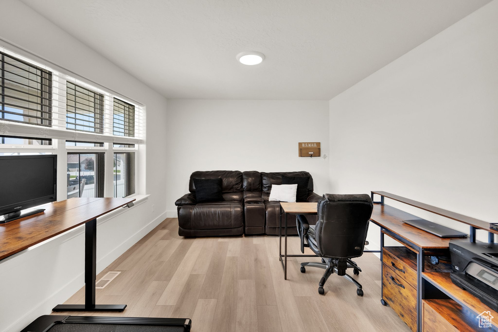Office featuring light wood-style floors and baseboards