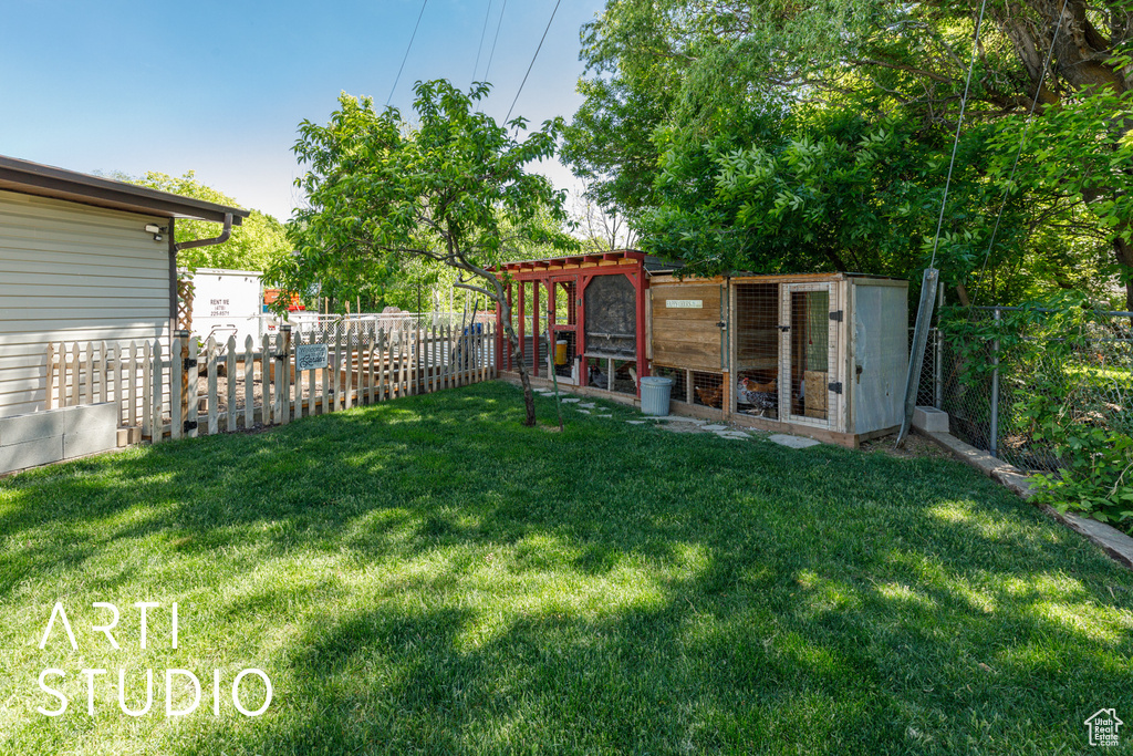 View of yard featuring exterior structure and an outdoor structure