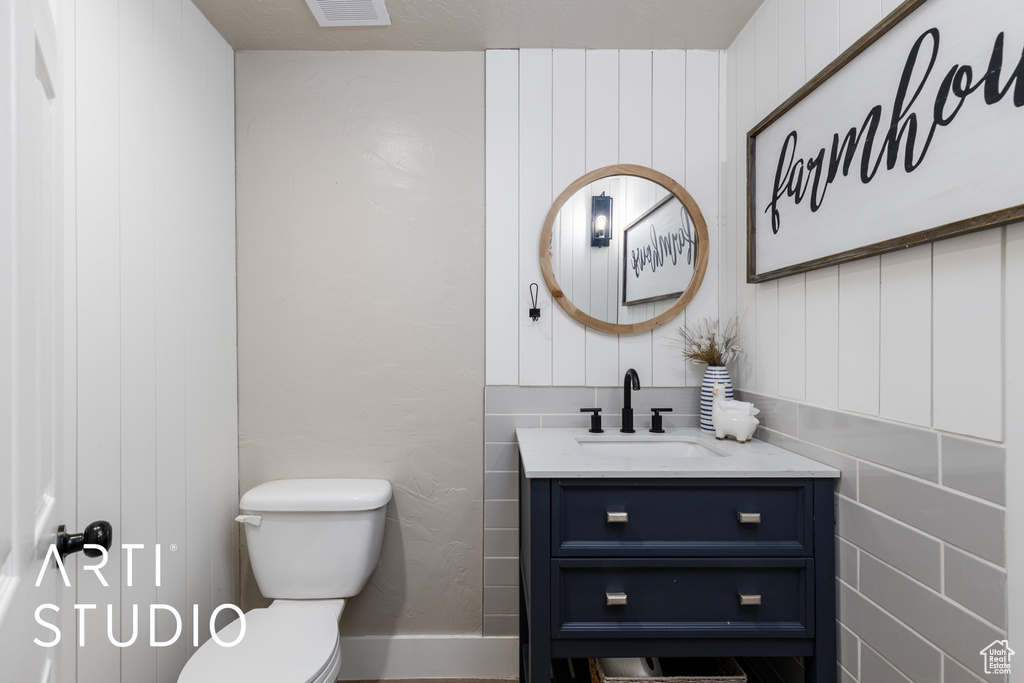 Bathroom featuring toilet and vanity