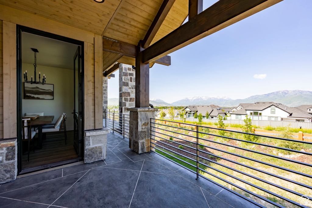 Balcony featuring a mountain view and a residential view