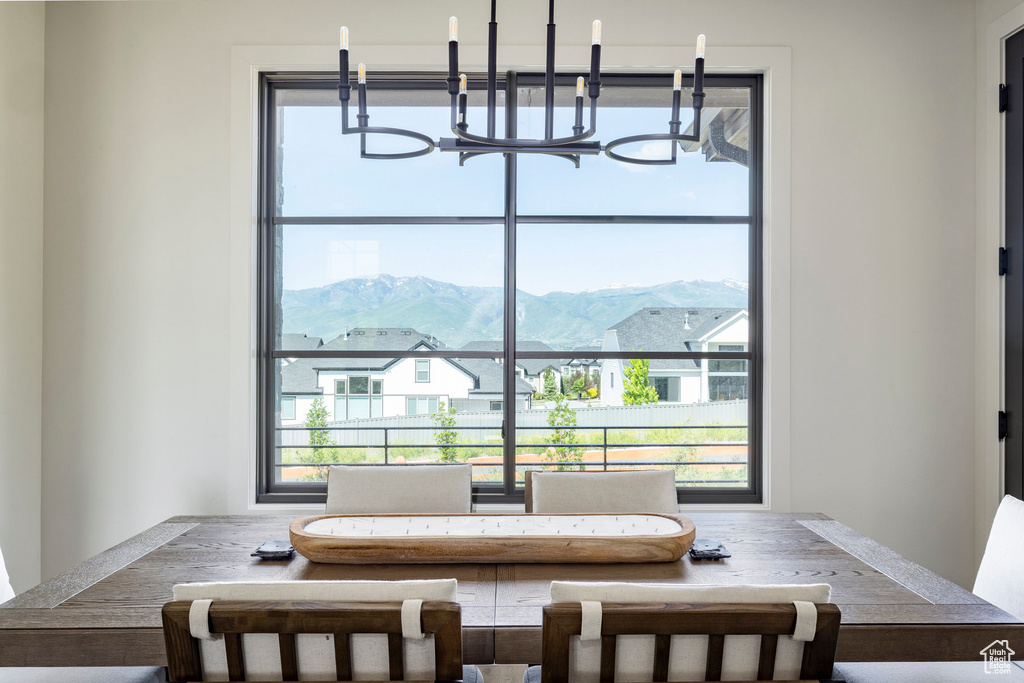 Dining space featuring a chandelier and a mountain view