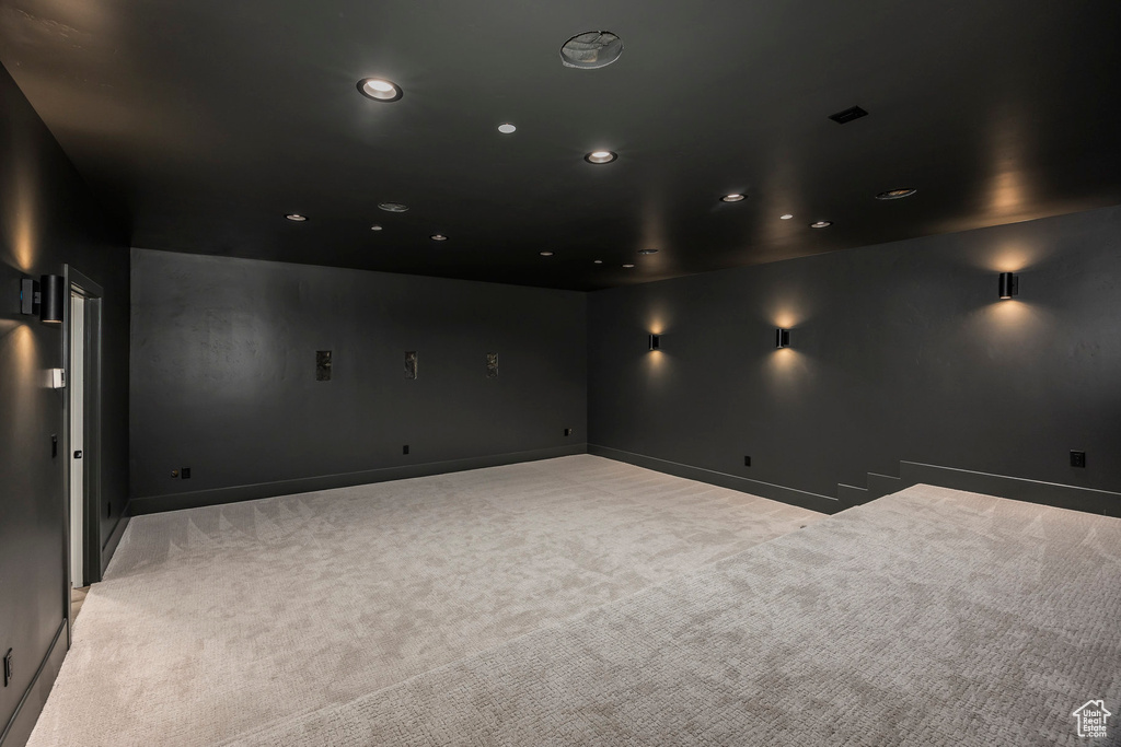 Carpeted cinema room featuring baseboards and recessed lighting