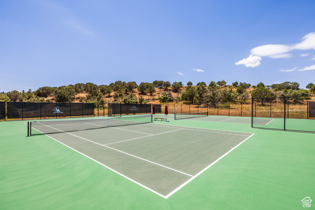 View of tennis court with community basketball court