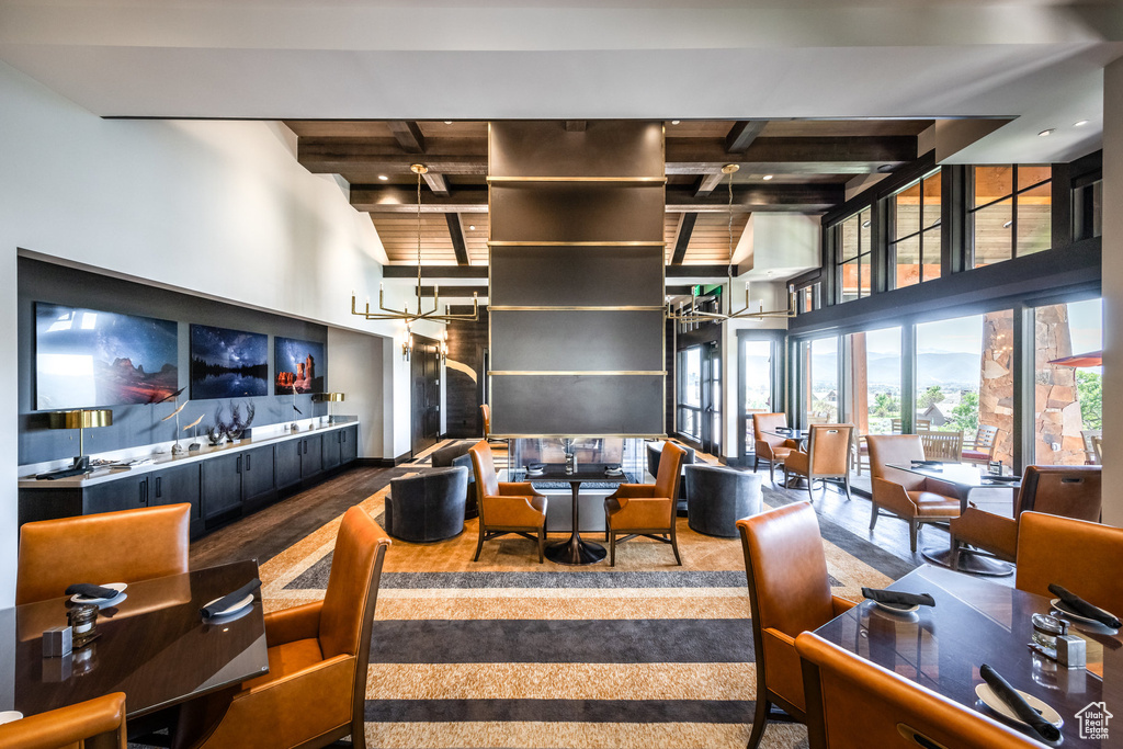Lobby featuring beam ceiling and a towering ceiling