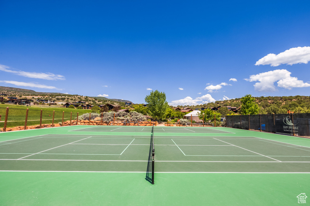 View of tennis court featuring community basketball court