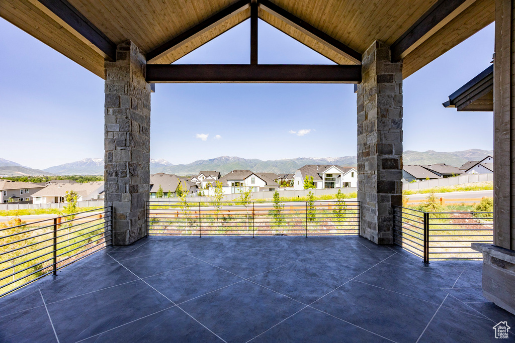 View of patio / terrace with a mountain view and a residential view