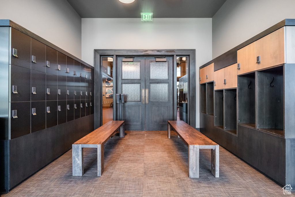 Mudroom featuring mail area and carpet flooring