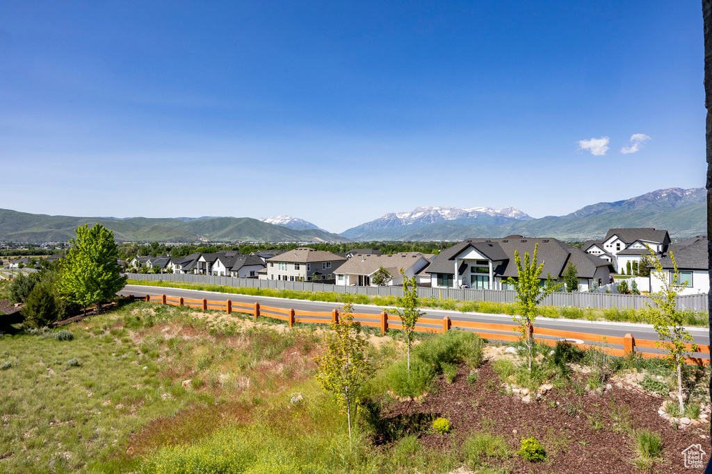 View of mountain backdrop featuring nearby suburban area