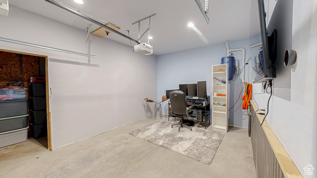 Office area with a garage and concrete flooring