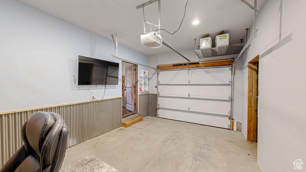 Garage featuring a garage door opener