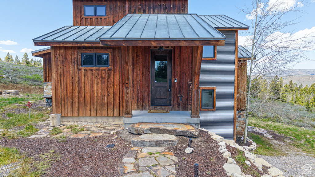 View of front of home featuring a standing seam roof and metal roof