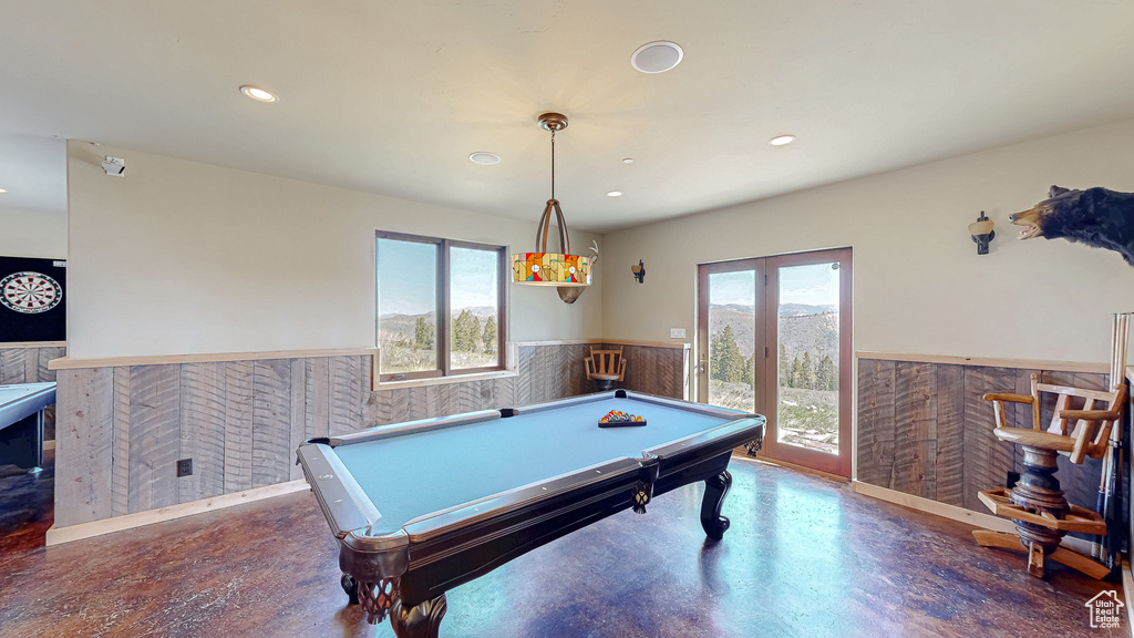 Rec room featuring wainscoting, recessed lighting, pool table, and finished concrete floors