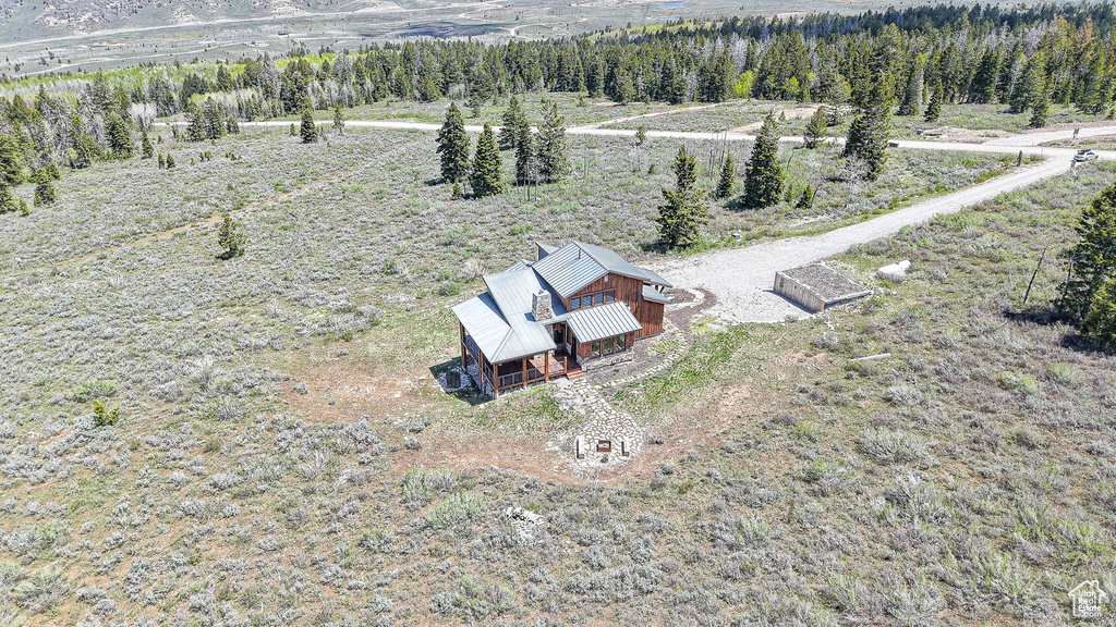 View of subject property featuring a heavily wooded area