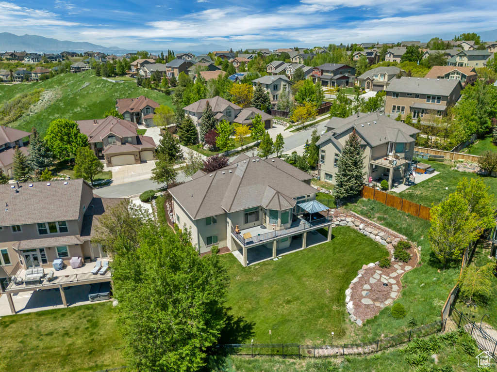 Aerial perspective of suburban area featuring a mountainous background
