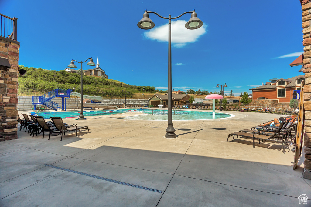 Community pool featuring a patio area
