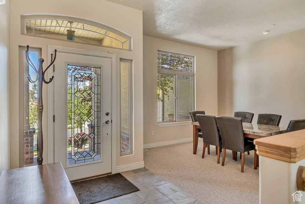 Entryway featuring healthy amount of natural light and baseboards