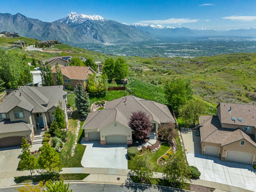 Aerial perspective of suburban area with a mountainous background