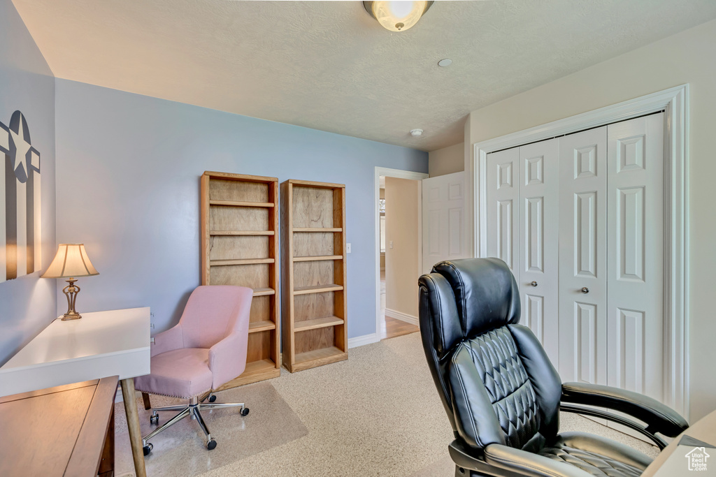 Office area featuring carpet flooring and baseboards