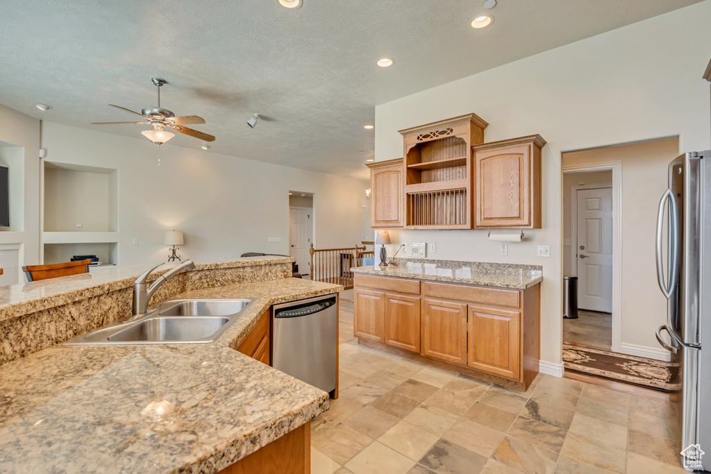 Kitchen featuring appliances with stainless steel finishes, a sink, ceiling fan, recessed lighting, and open shelves