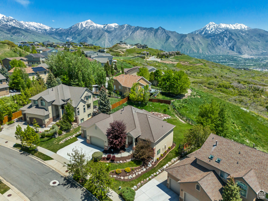 Aerial perspective of suburban area with a mountain backdrop