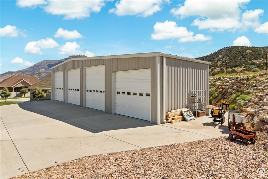 Detached garage featuring a mountain view
