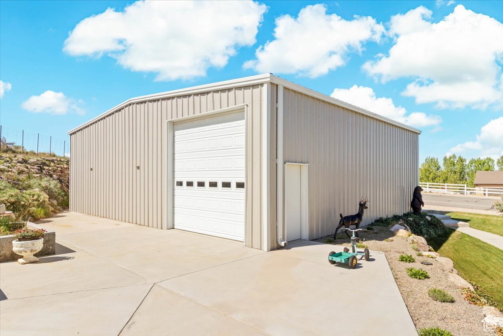 Detached garage with concrete driveway