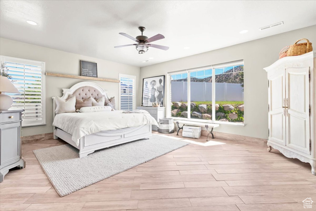 Bedroom featuring light wood-style flooring, recessed lighting, and ceiling fan