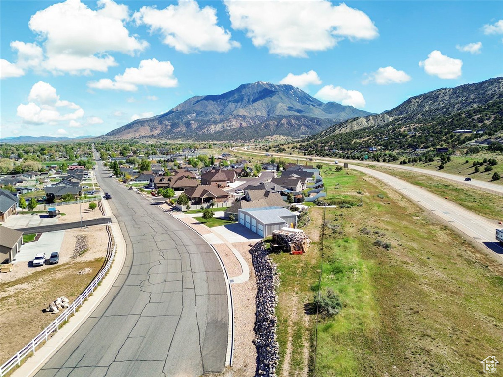 Aerial perspective of suburban area featuring a mountainous background