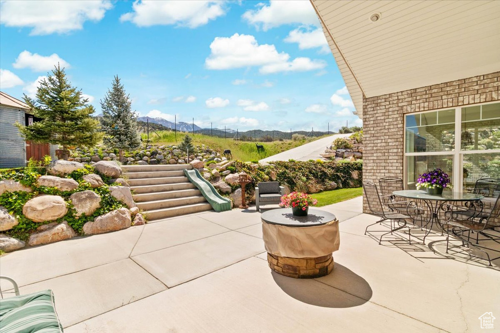 View of patio featuring a mountain view