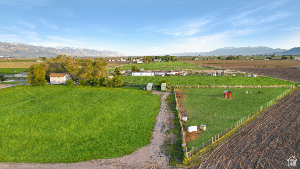 Aerial view of sparsely populated area with a mountain backdrop