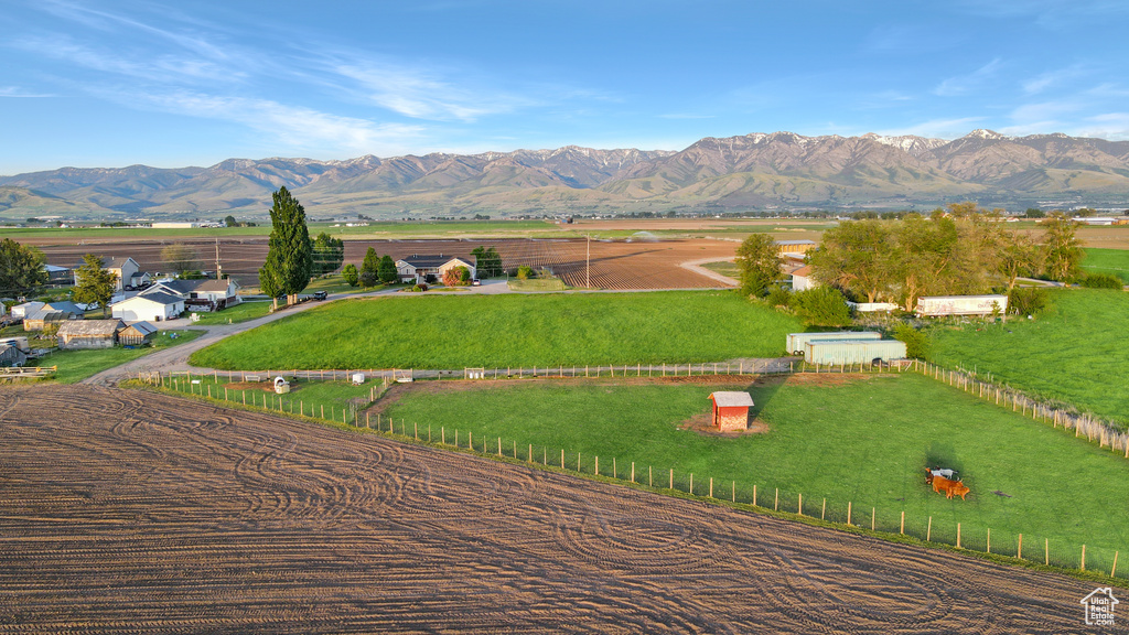 View of mountain backdrop with rural landscape