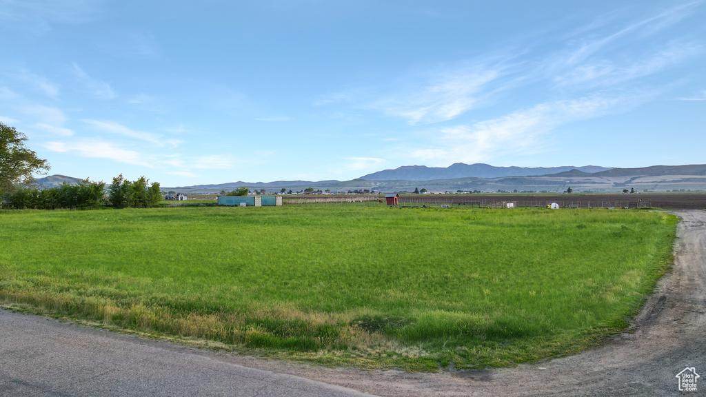 View of mountain backdrop featuring rural landscape