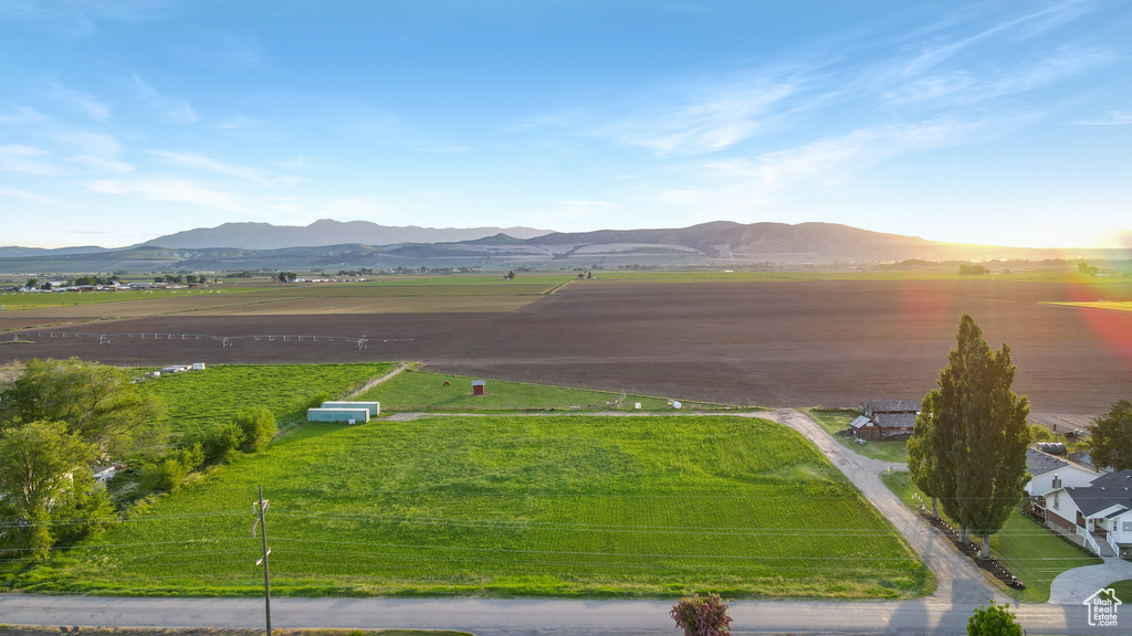 View of mountain background featuring rural landscape