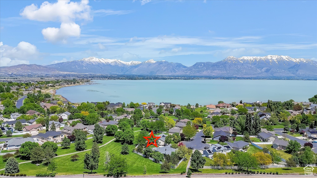 Aerial perspective of suburban area with a water and mountain view