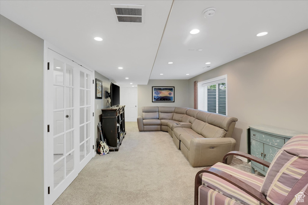 Living area featuring recessed lighting and carpet floors