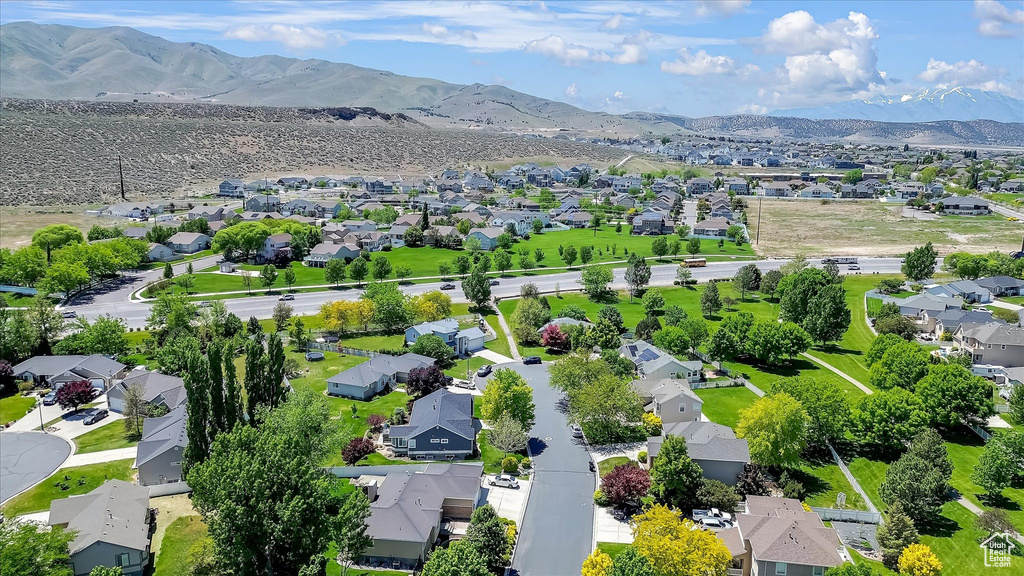 Aerial perspective of suburban area with a mountainous background