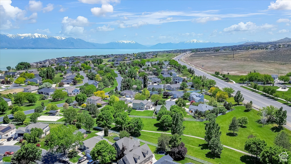 Aerial view of residential area featuring a water and mountain view