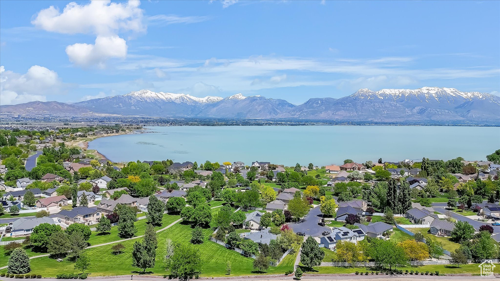 Aerial perspective of suburban area with a water and mountain view