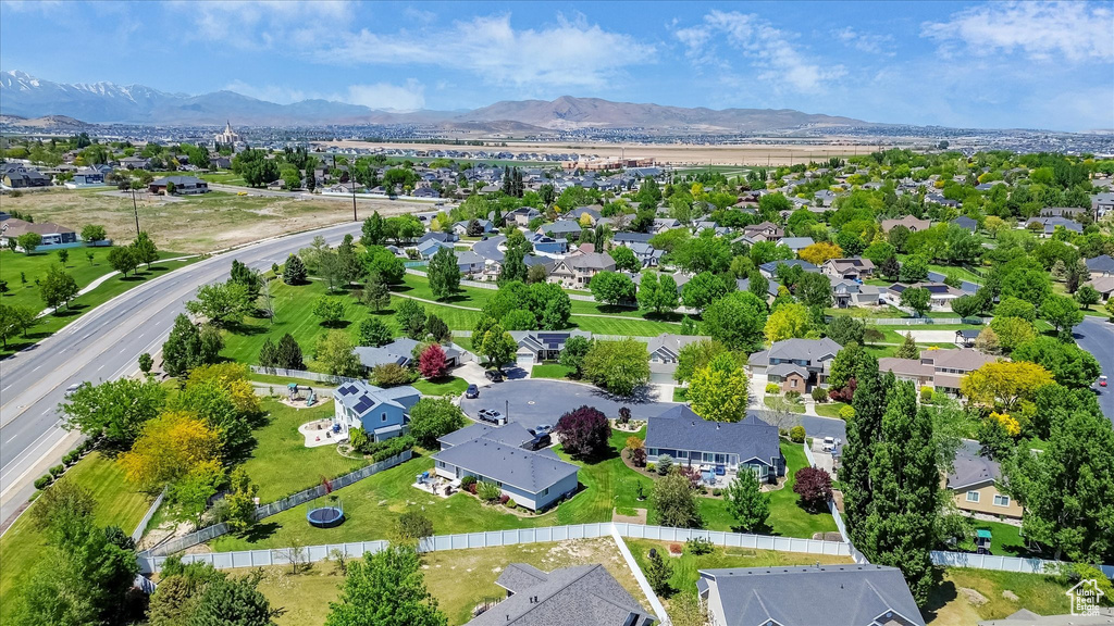 Aerial perspective of suburban area with a mountainous background