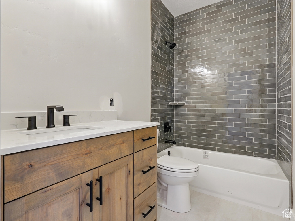 Full bath featuring vanity, shower / tub combination, and toilet