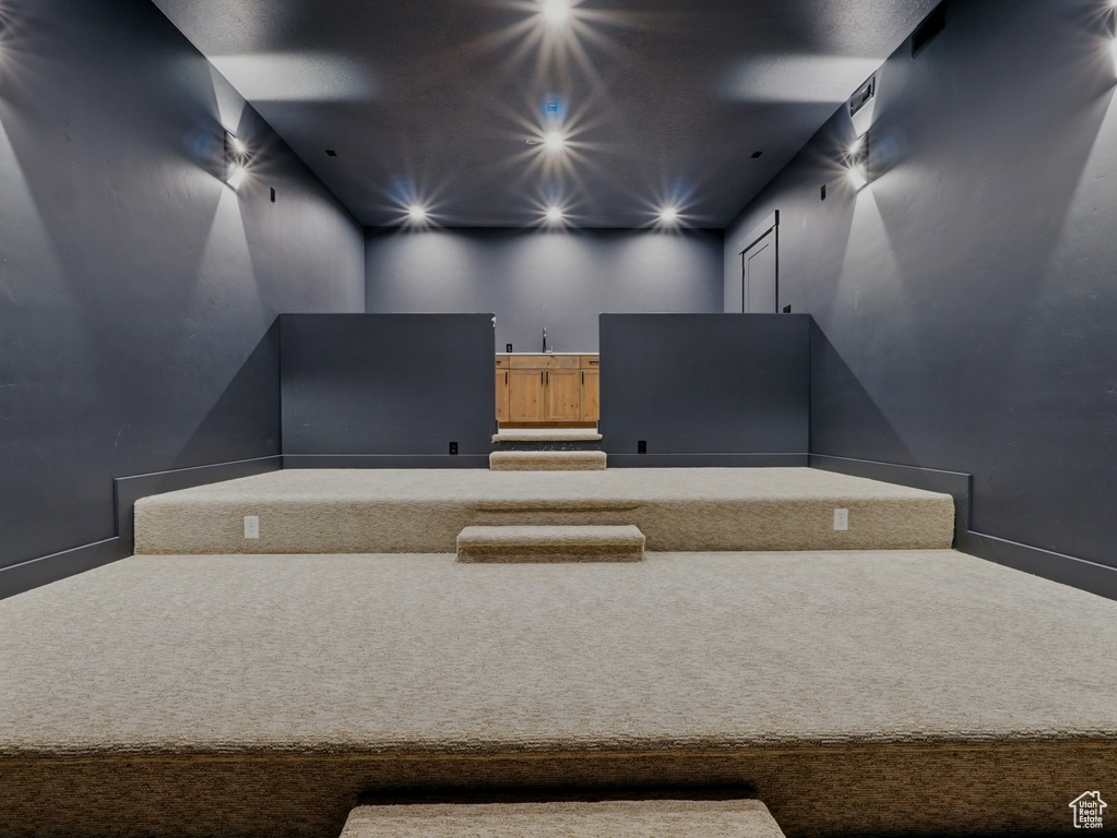 Cinema room with carpet floors, recessed lighting, and baseboards