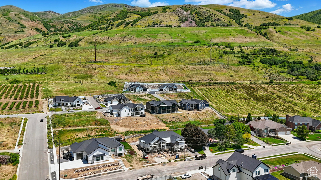 Aerial view of sparsely populated area featuring mountains and nearby suburban area