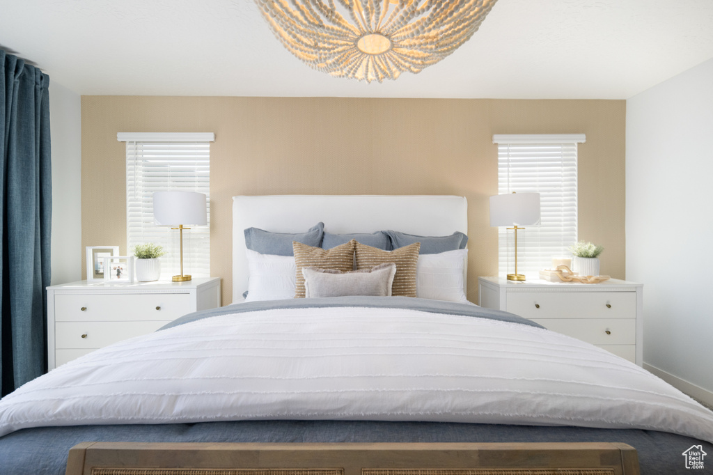 Bedroom with multiple windows