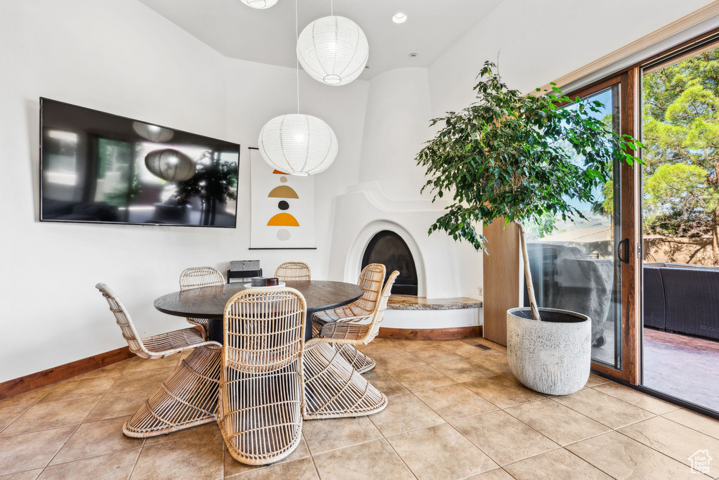 Dining room featuring tile patterned floors and baseboards