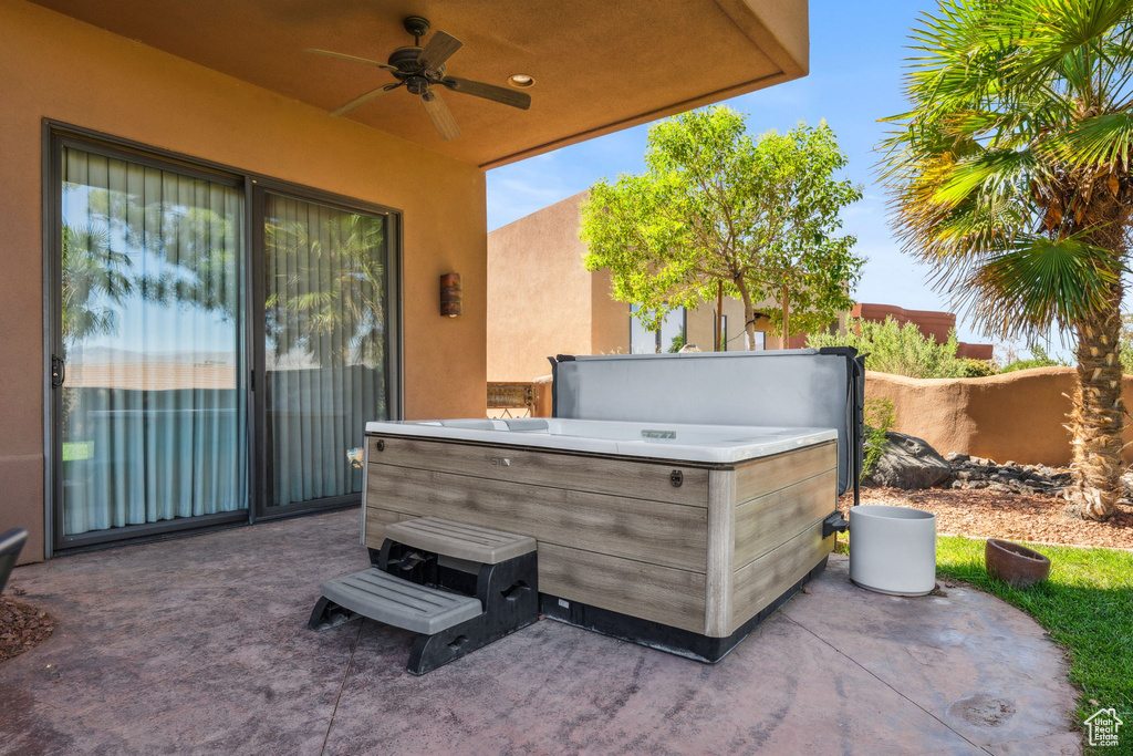 View of patio / terrace featuring a hot tub and ceiling fan